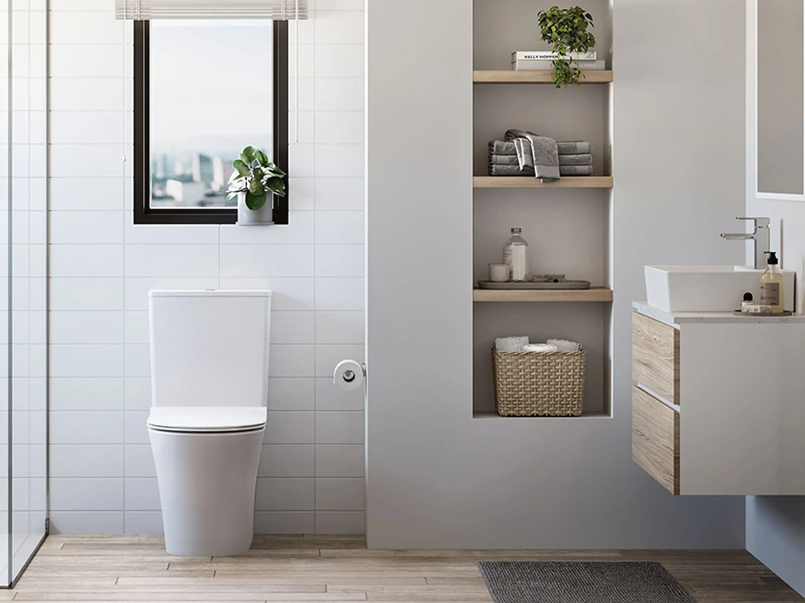 Modern bathroom with white toilet, built-in shelving with towels and plants, and a floating wood vanity with white sink.