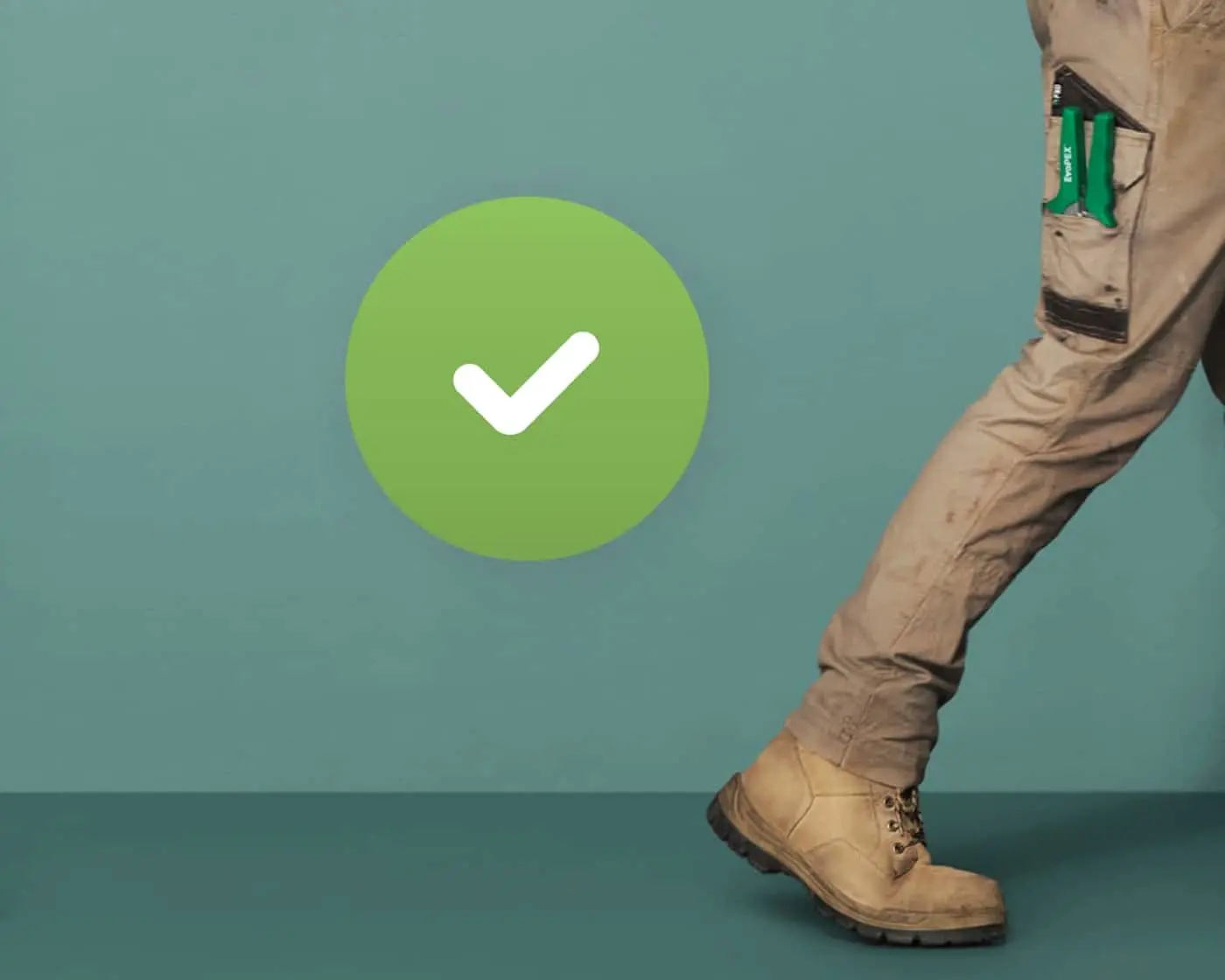 Green checkmark icon with person in work pants and boots walking, green tools visible in pocket against teal background.