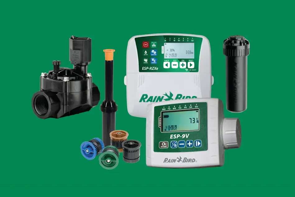 Rain Bird irrigation system components including digital controllers, valve, sprinkler heads and nozzles on green background.