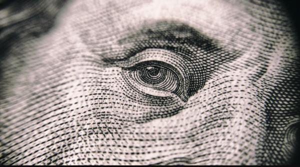 A closeup of Ben Franklin's eye as it appears on US bills