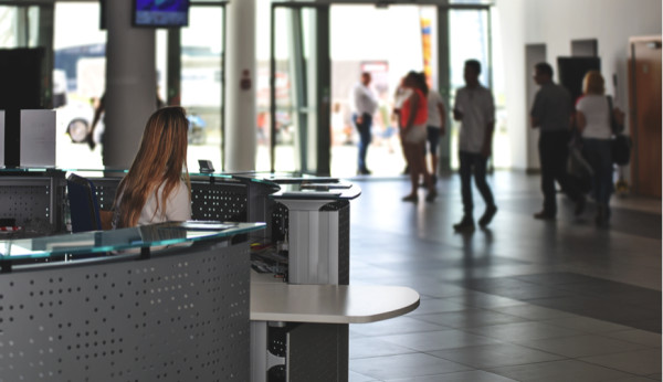 Woman sitting at reception desk