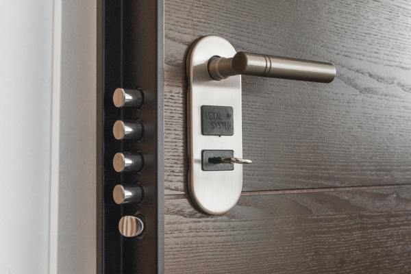 A deadbolt door lock with handle.