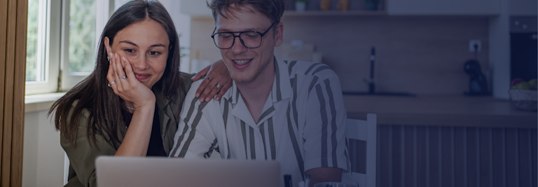 Young man and women looking at a laptop