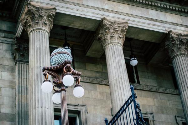 pillars on the exterior of an old timey building, presumably a courthouse