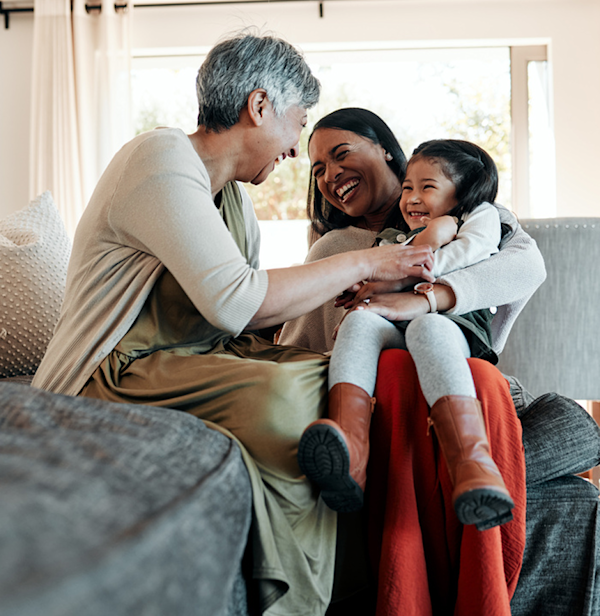 A woman holding a laughing child