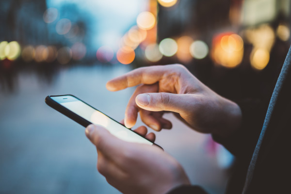 Up close image of someone tapping their smartphone