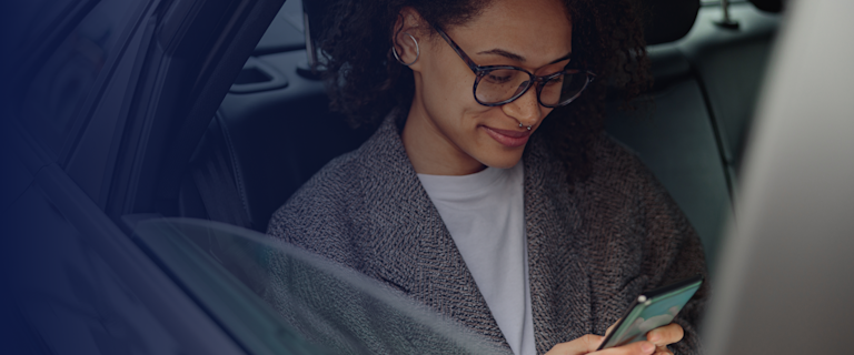 Woman in car viewing device