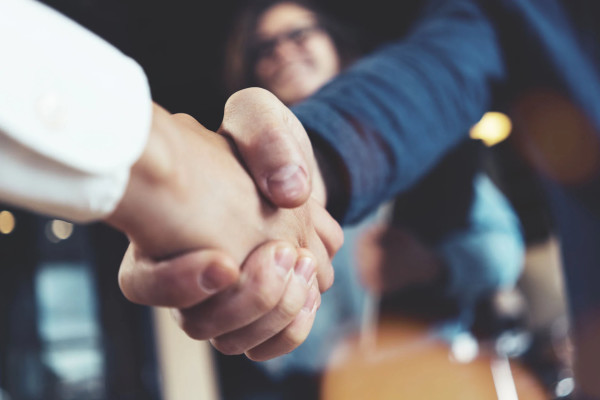 Close up photo of a handshake.