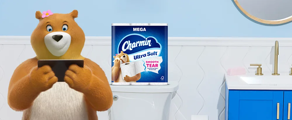 Molly looking at tablet in bathroom