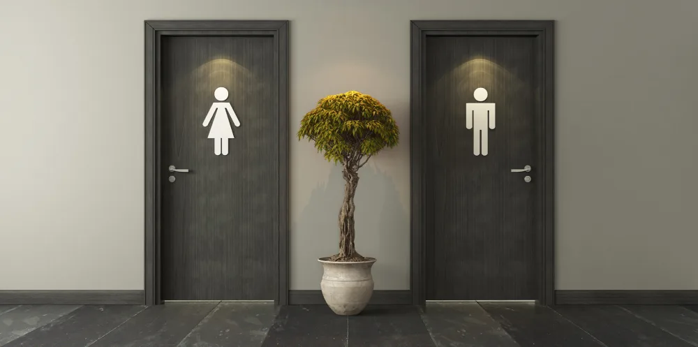 Women's bathroom and men's bathroom side by side in an office building