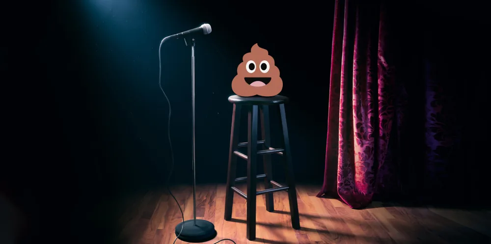 Stand up comedy stage with mic, chair and a poop emoji on top