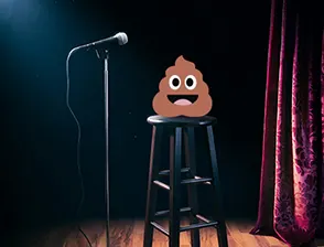 Poop emoji on a chair, performing on a comedy stage
