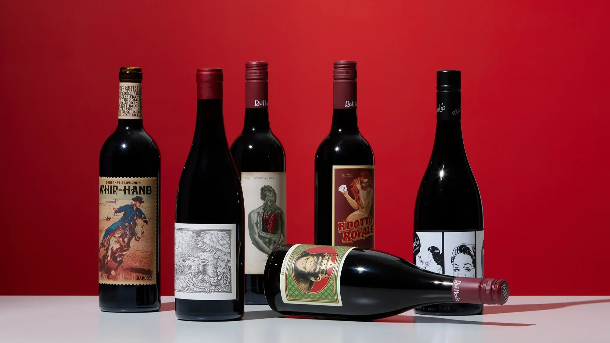 Mixed selection of red wines featuring bottles from different producers.