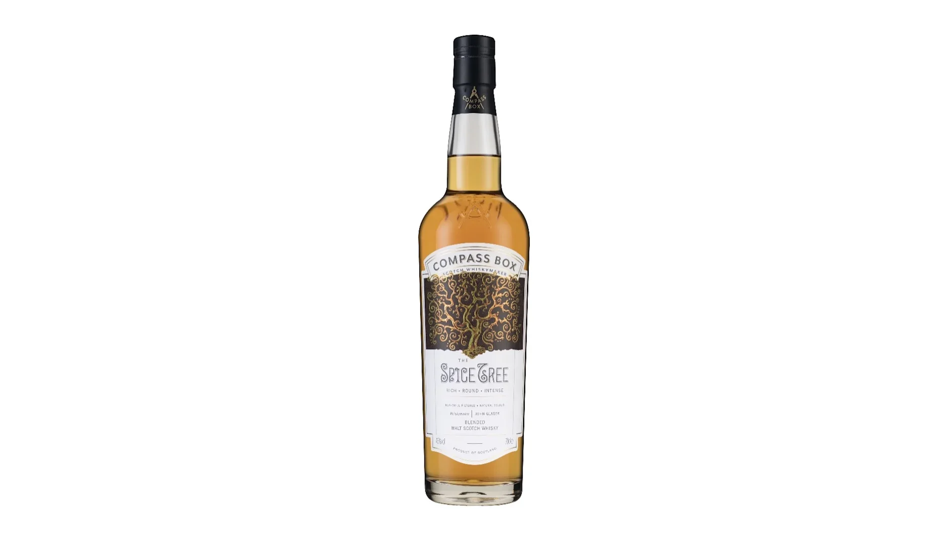 A bottle of Compass Box Spice Tree blended Scotch whisky with a white label featuring a decorative tree design on a plain background.