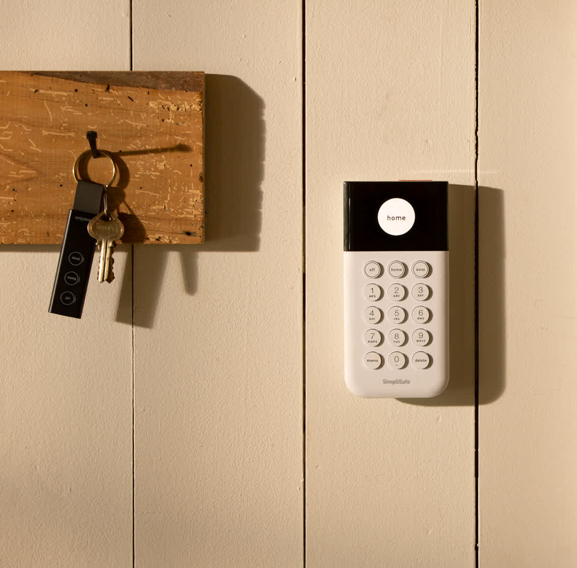 SimpliSafe Keypad on wall next to key hook