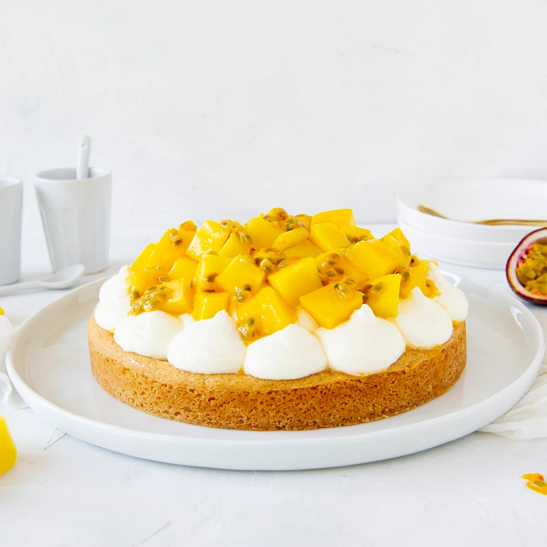 Recept: Ronde cheesecake mango-passievrucht slof - Bakken.nl