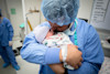 Partners:  Your presence is so important at a cesarean birth!  Talk to your baby, welcome them into the world, and advocate for skin to skin and no separation for your baby and your partner in the OR as much as you can.
