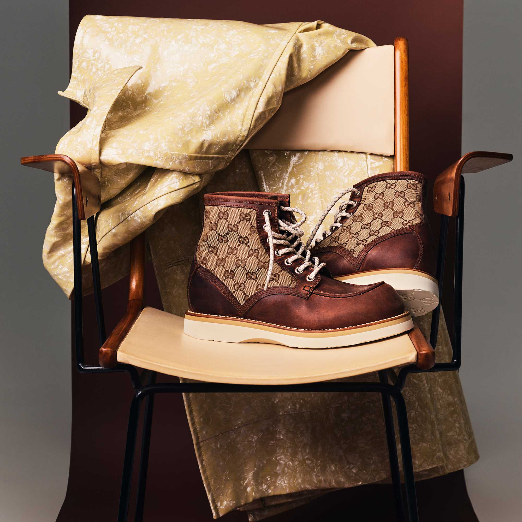 Gucci Re-Motion sneakers on a chair