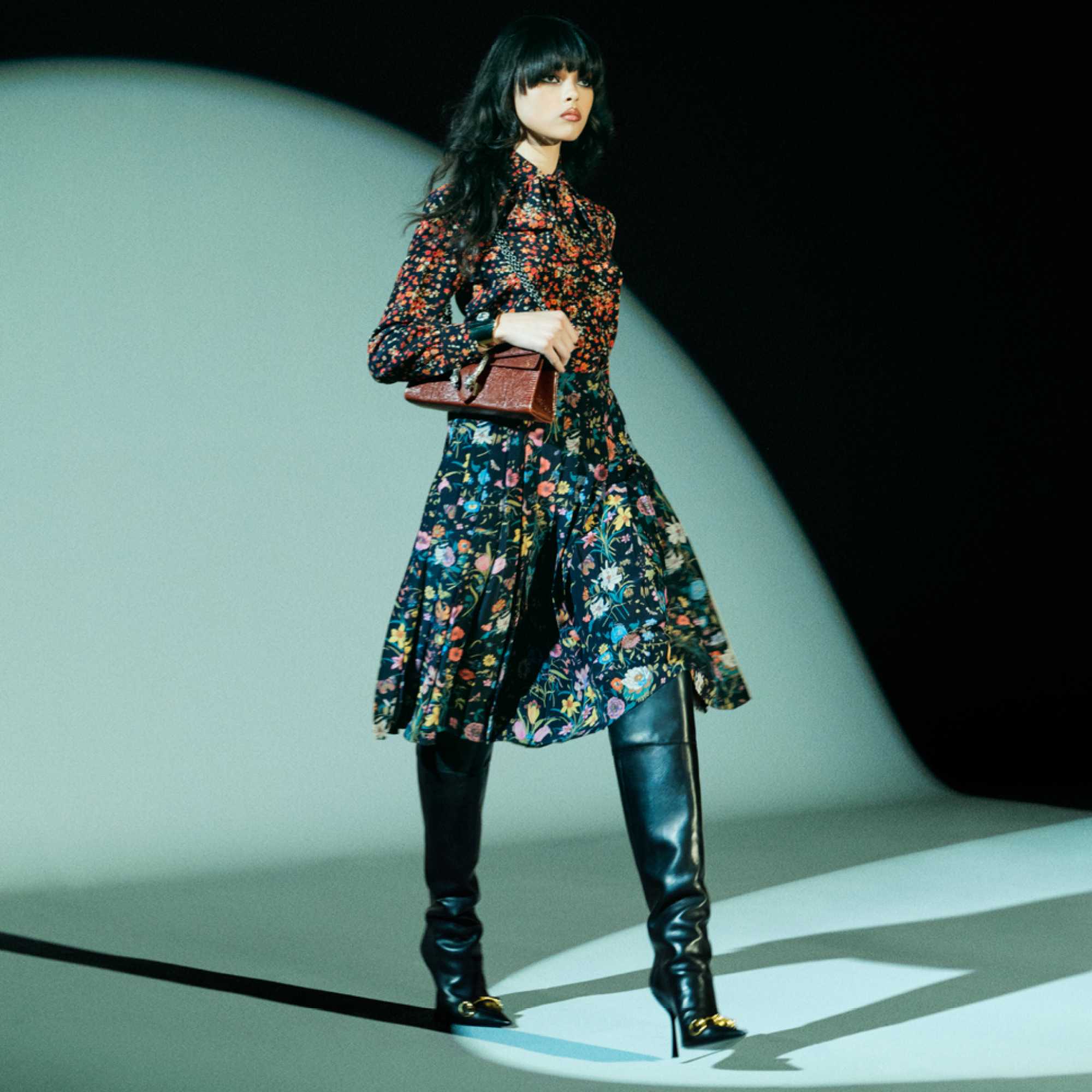 Black Gucci suit and handbag