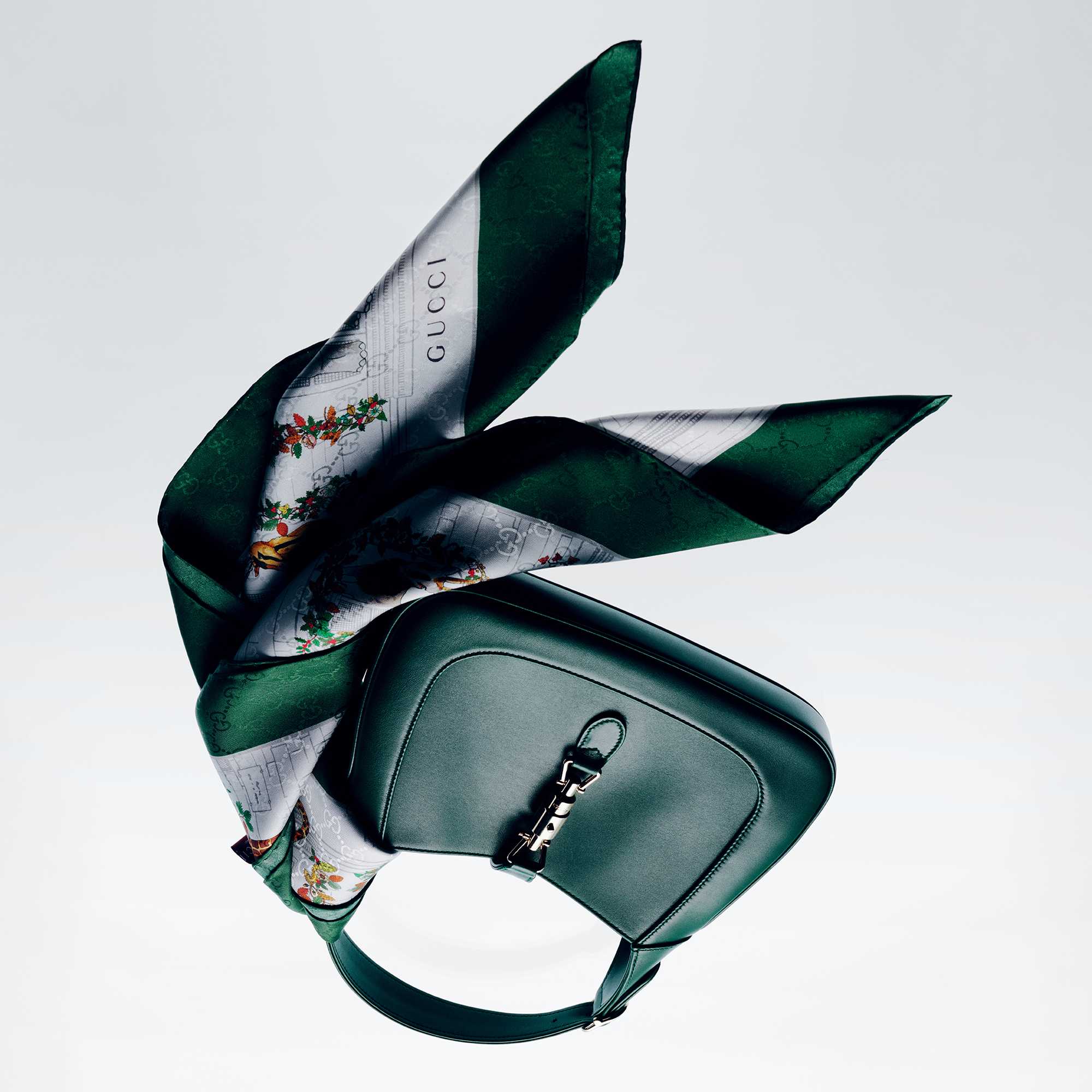 Green Gucci handbag with scarf