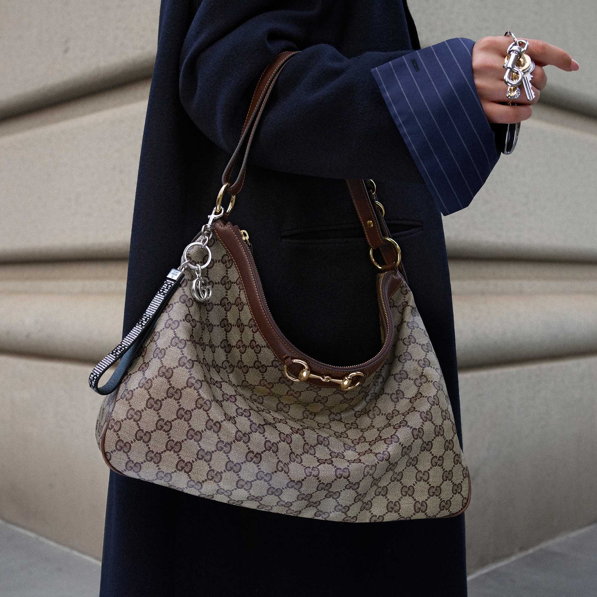 Black Gucci suit and handbag