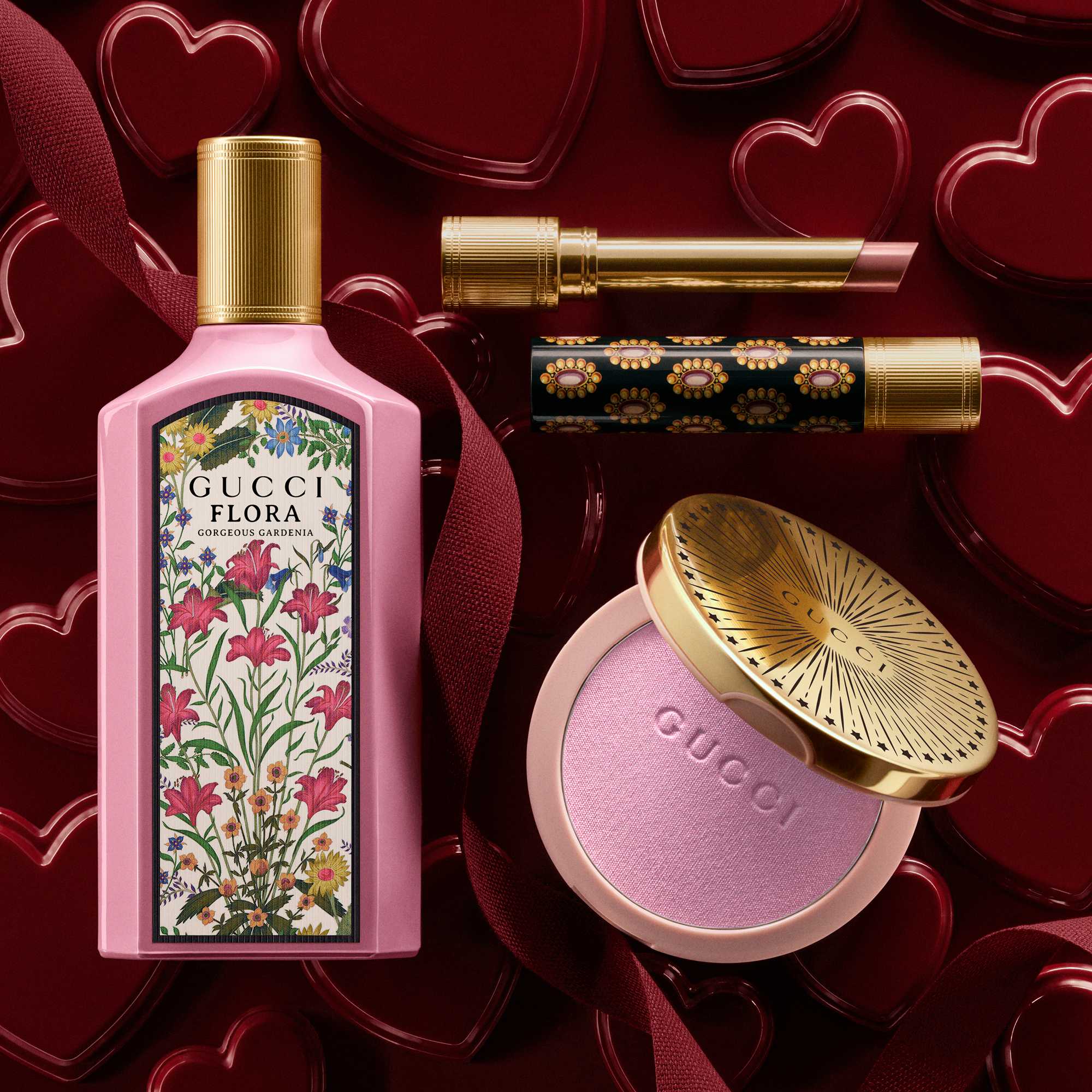 Gucci beauty products on red