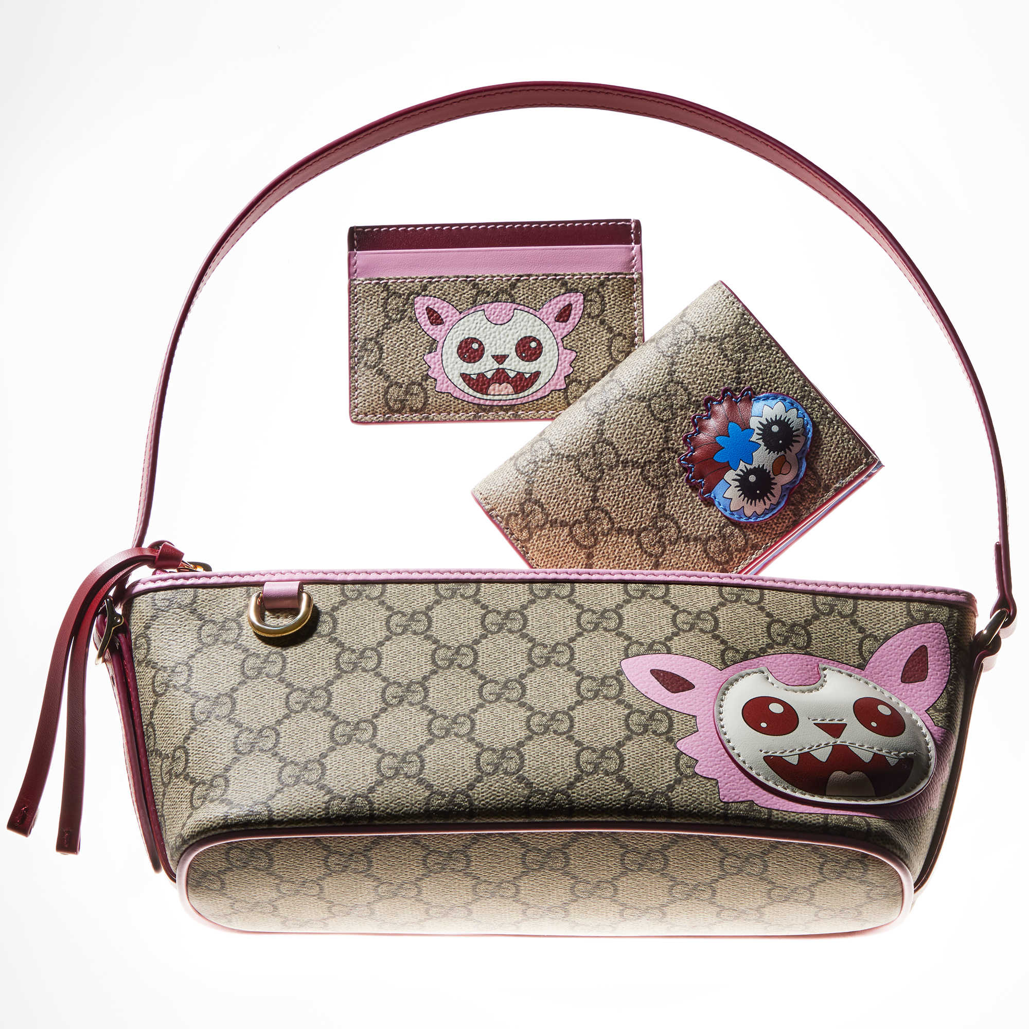 Gucci monogram bags with pink accents.