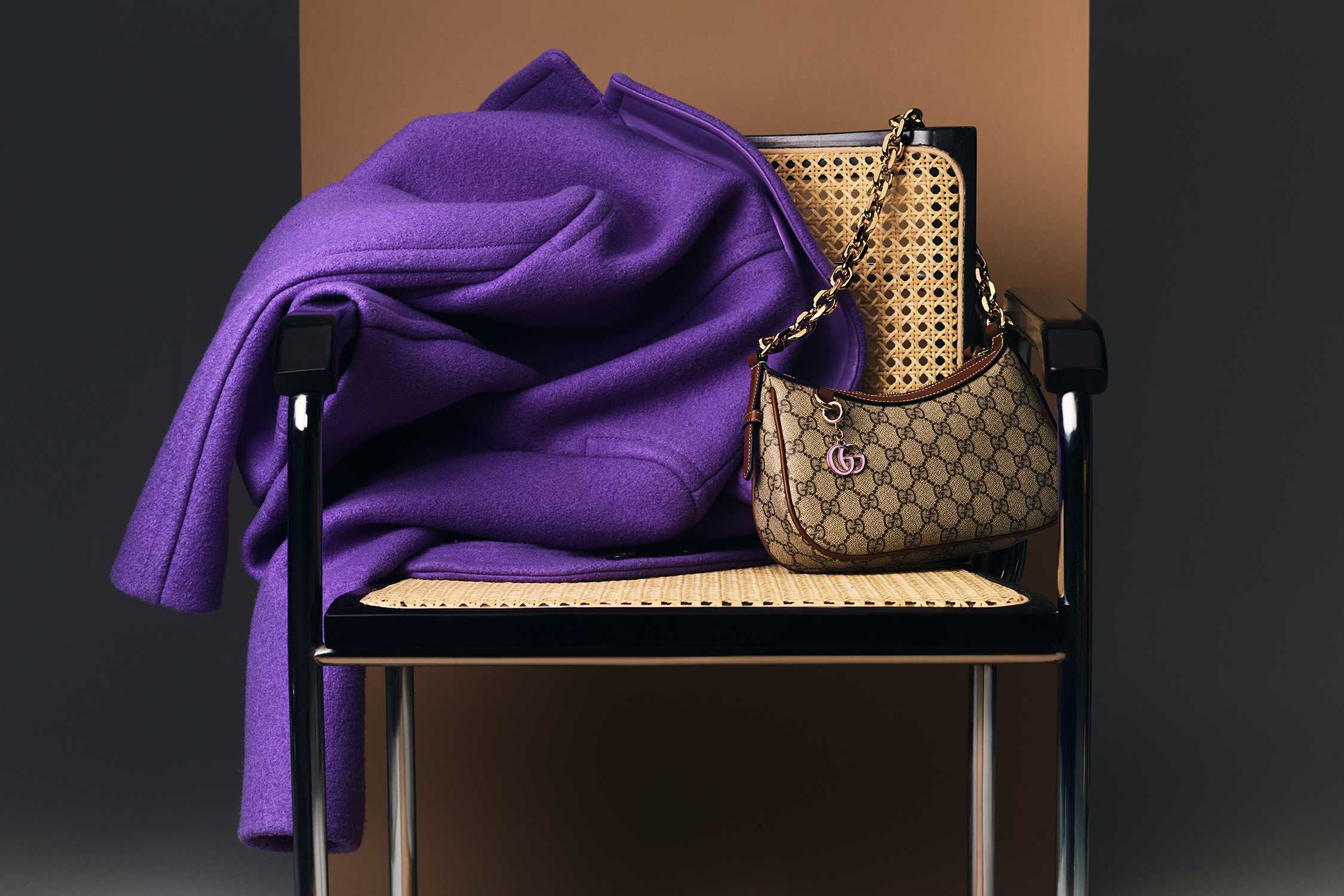 Purple coat with Gucci handbag