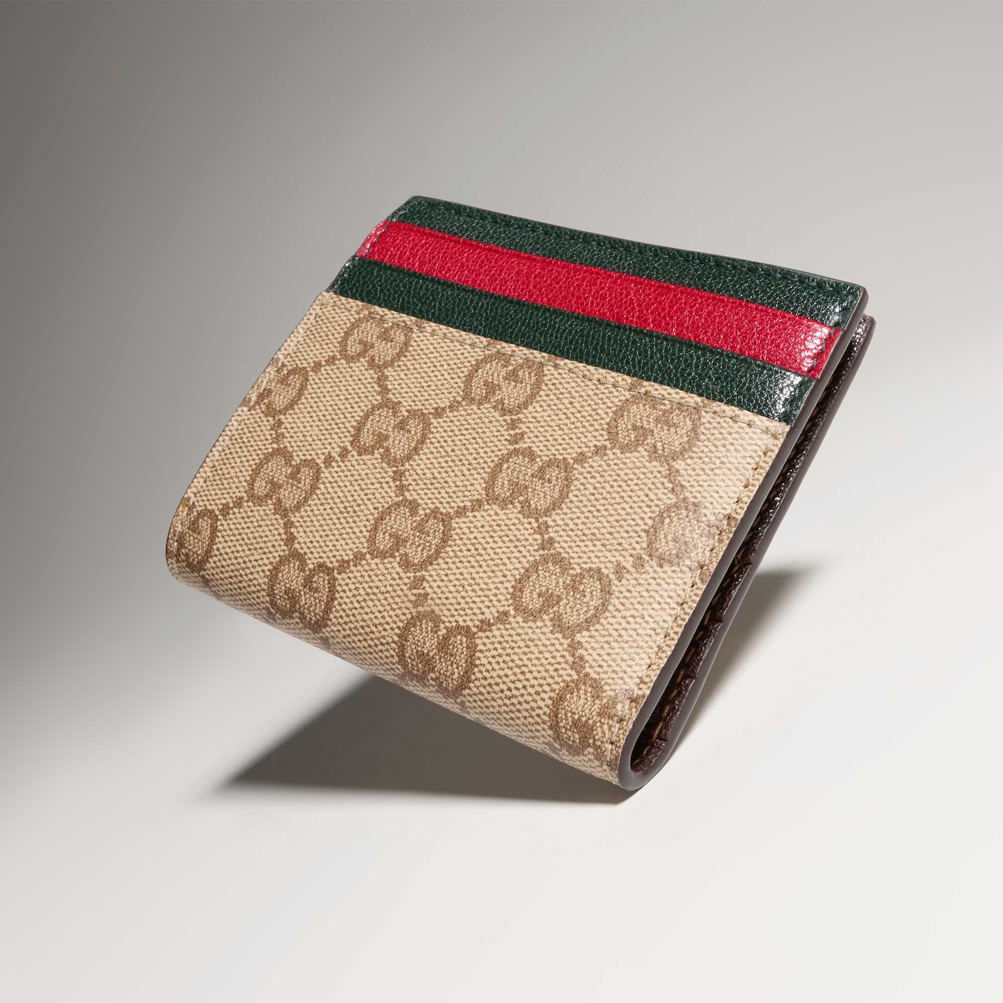 Beige Gucci wallets with red-green stripes.