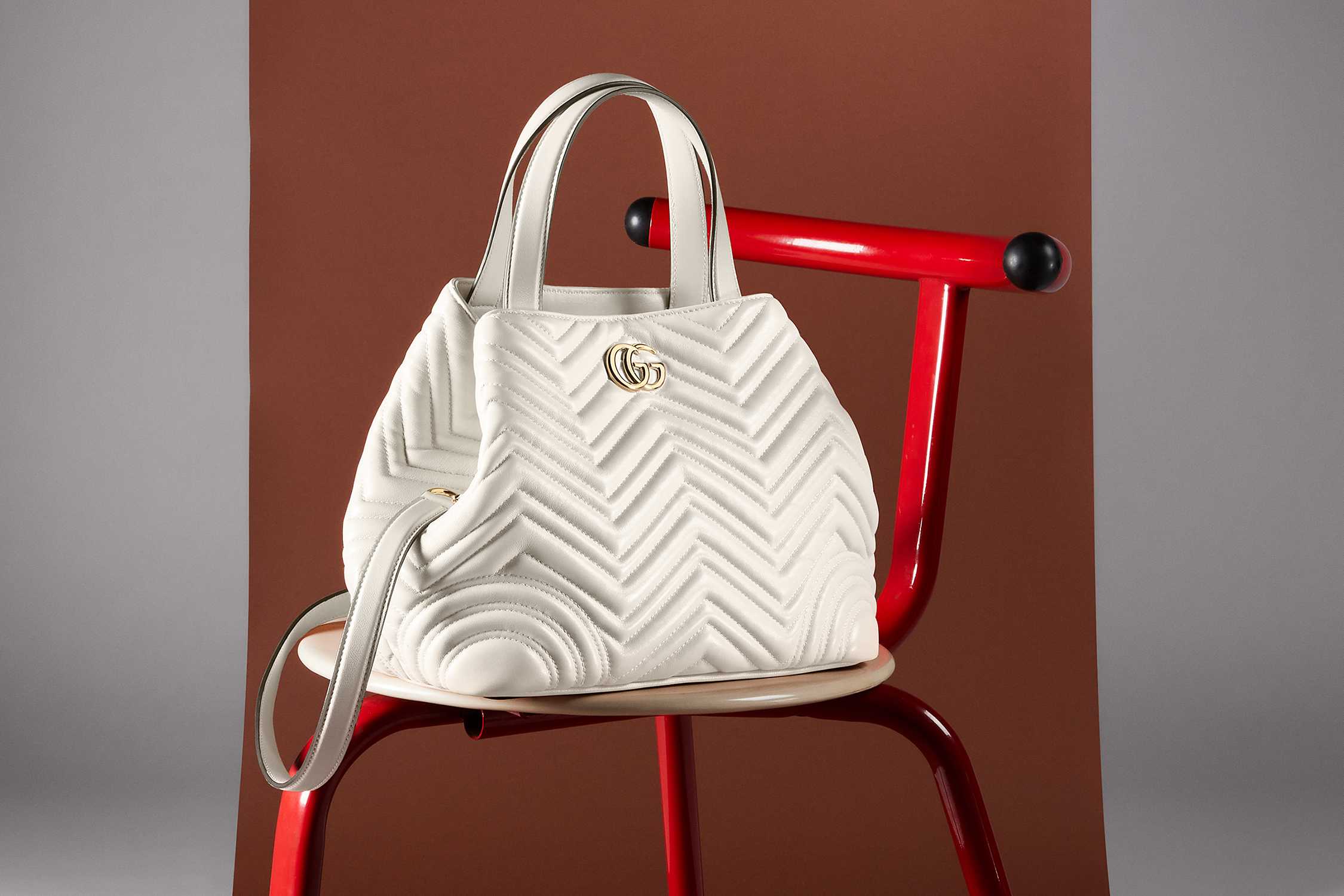 White Gucci quilted handbag displayed
