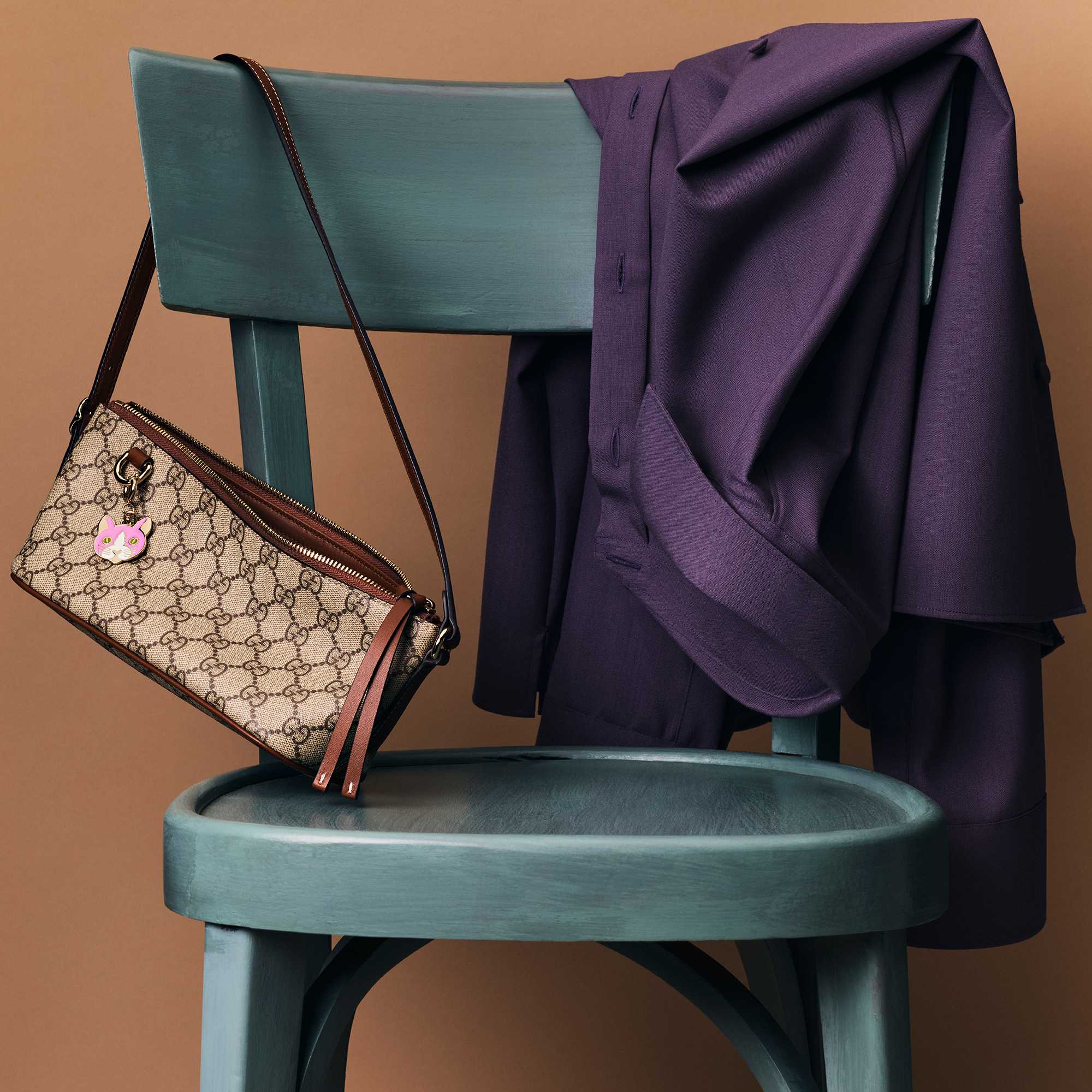 GG Emblem mini bag with cat charm