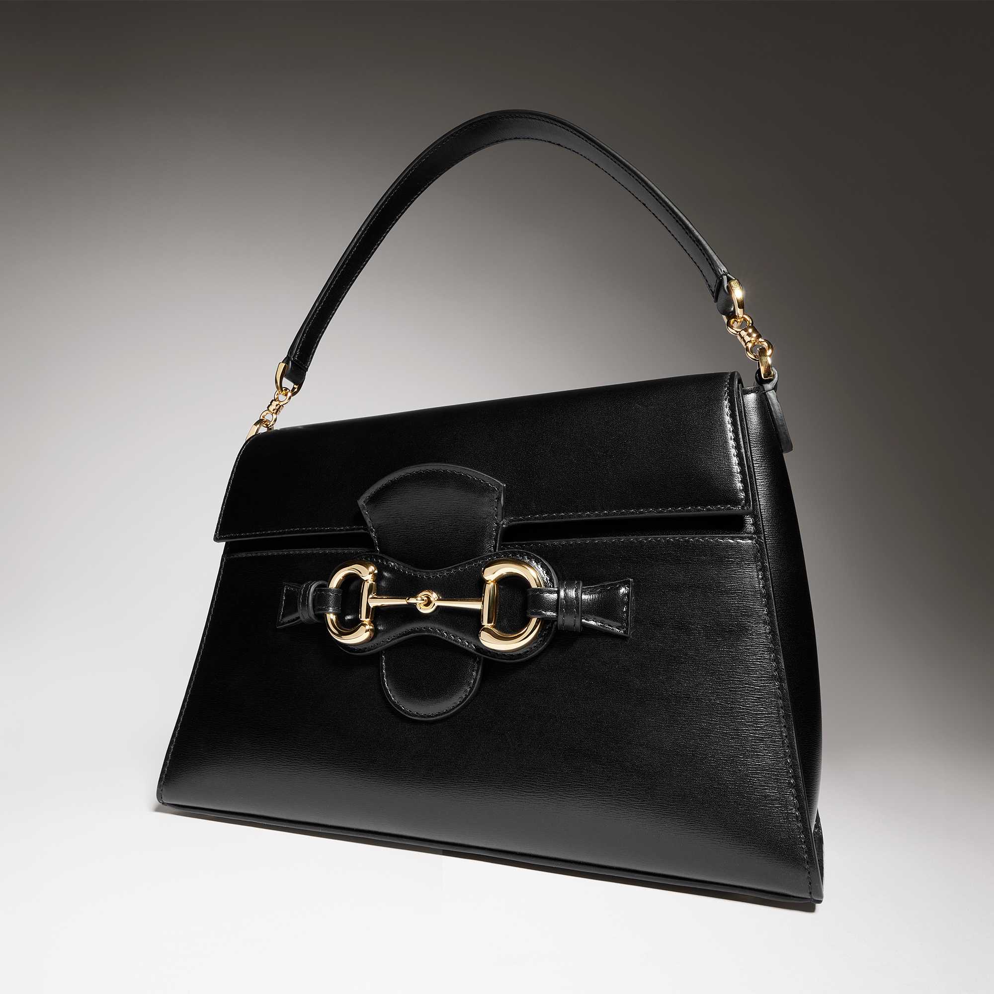 Black Gucci sunglasses and bag