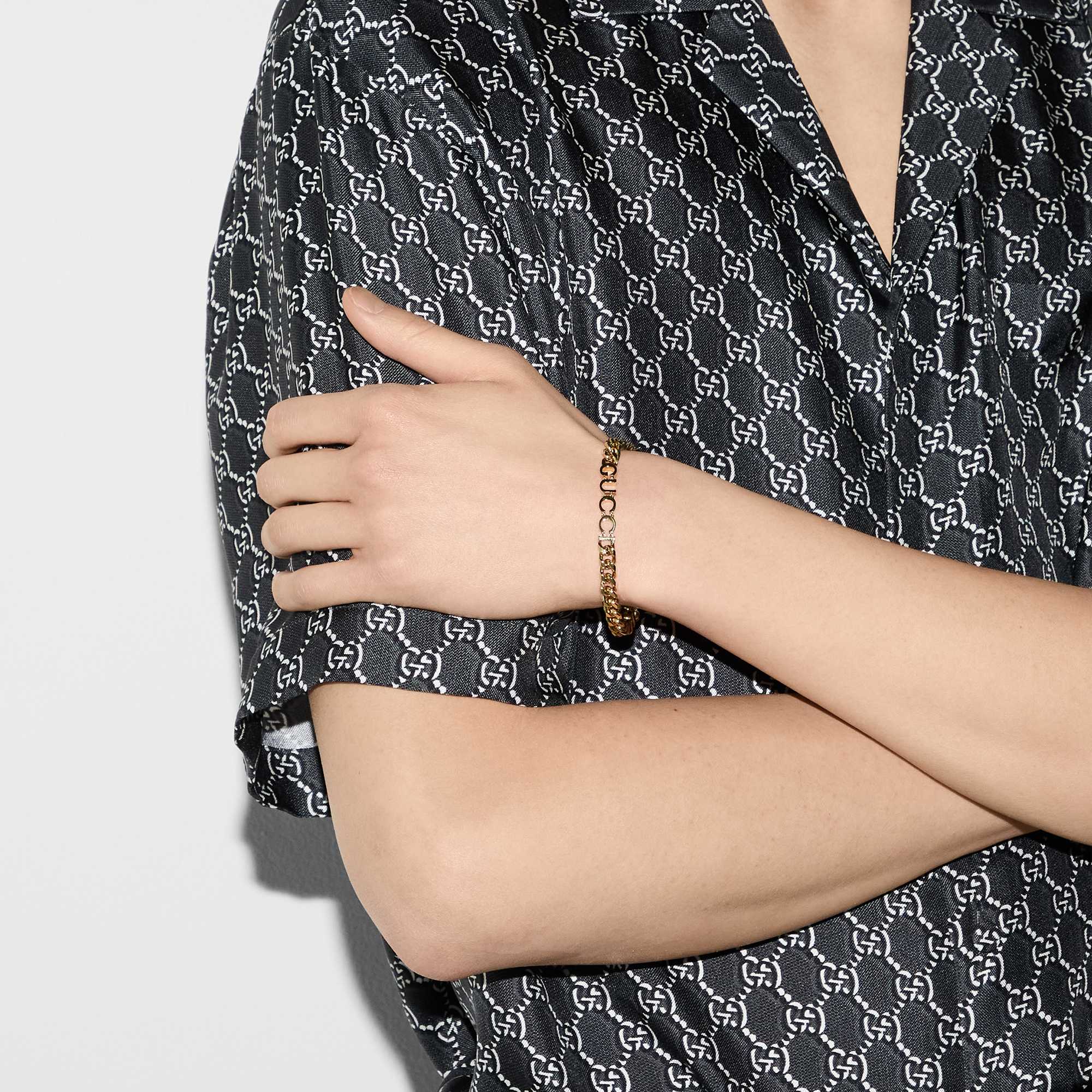Gold Gucci bracelet, monogram outfit