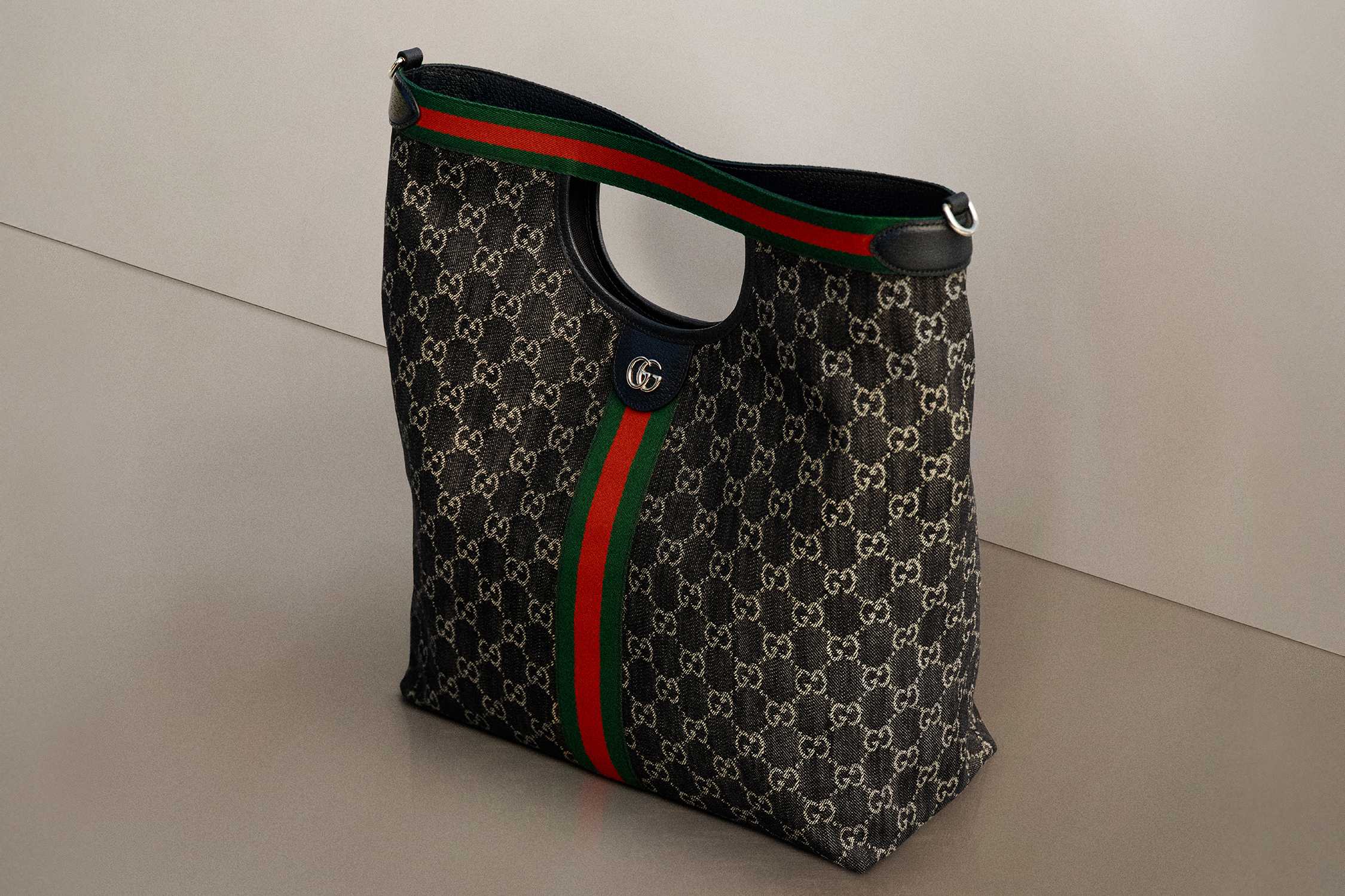 Gucci monogram bag with red-green stripe.