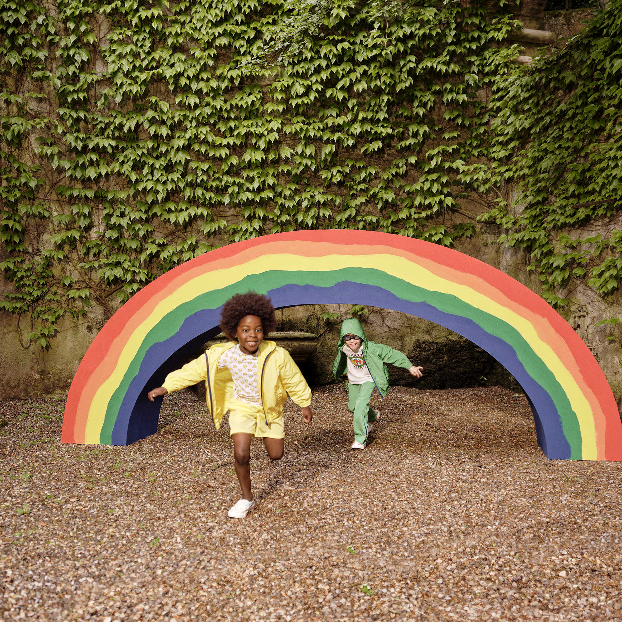Green Gucci children's outfit outdoors