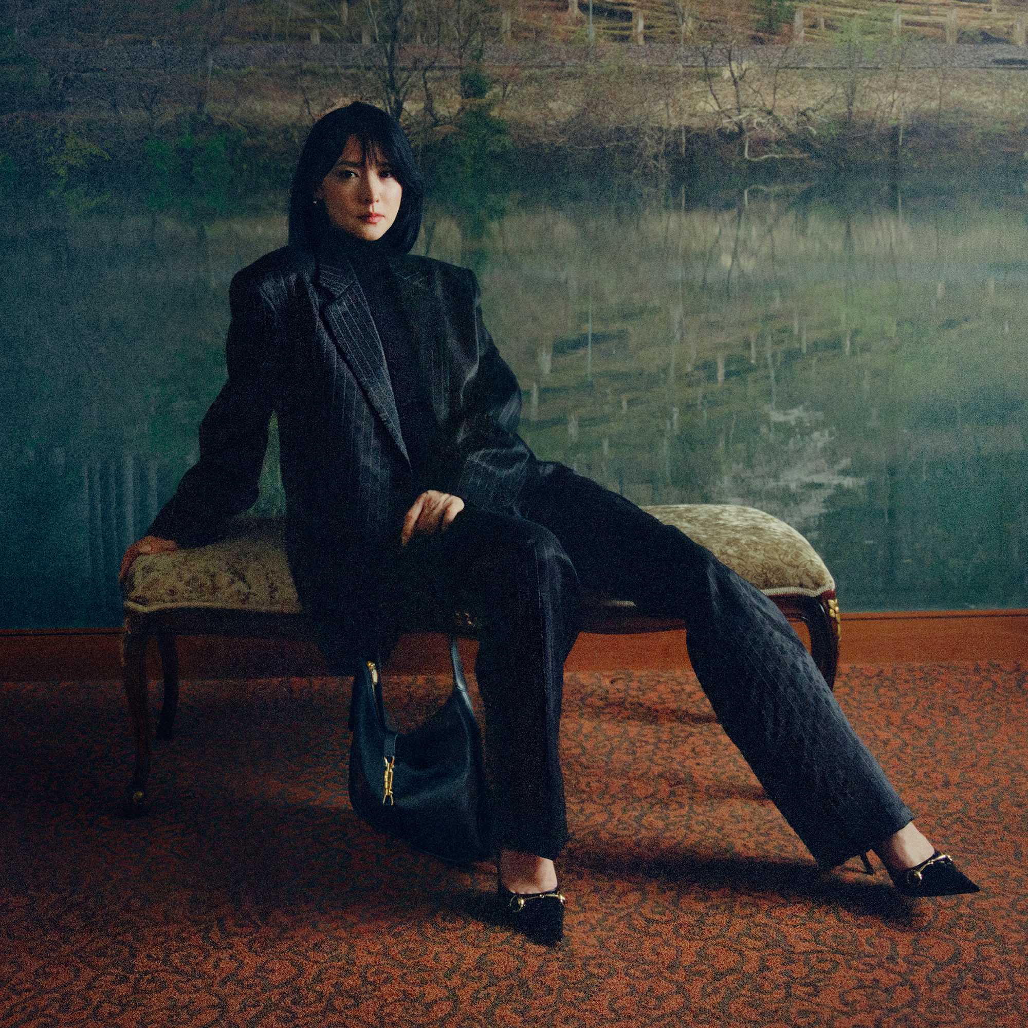 Black Gucci suit and handbag