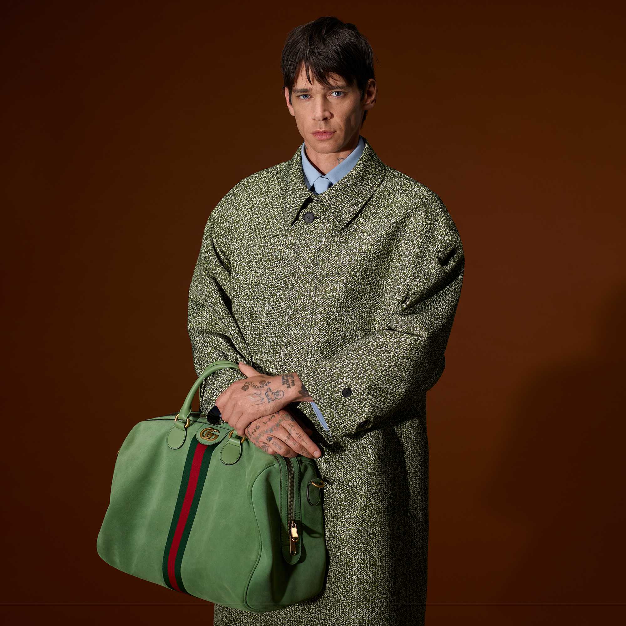 Grey suit with Gucci bag