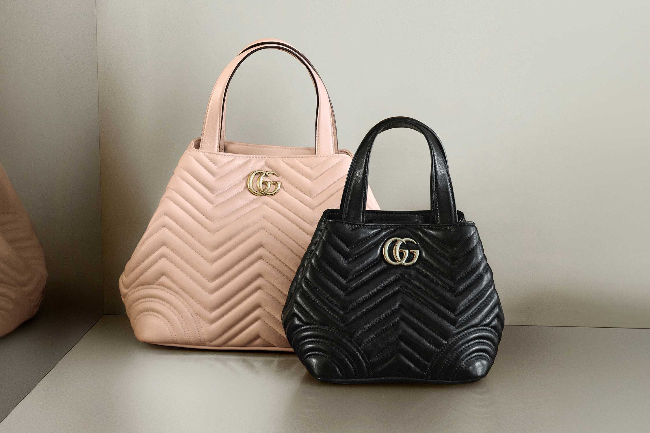 Pink and black Gucci handbags