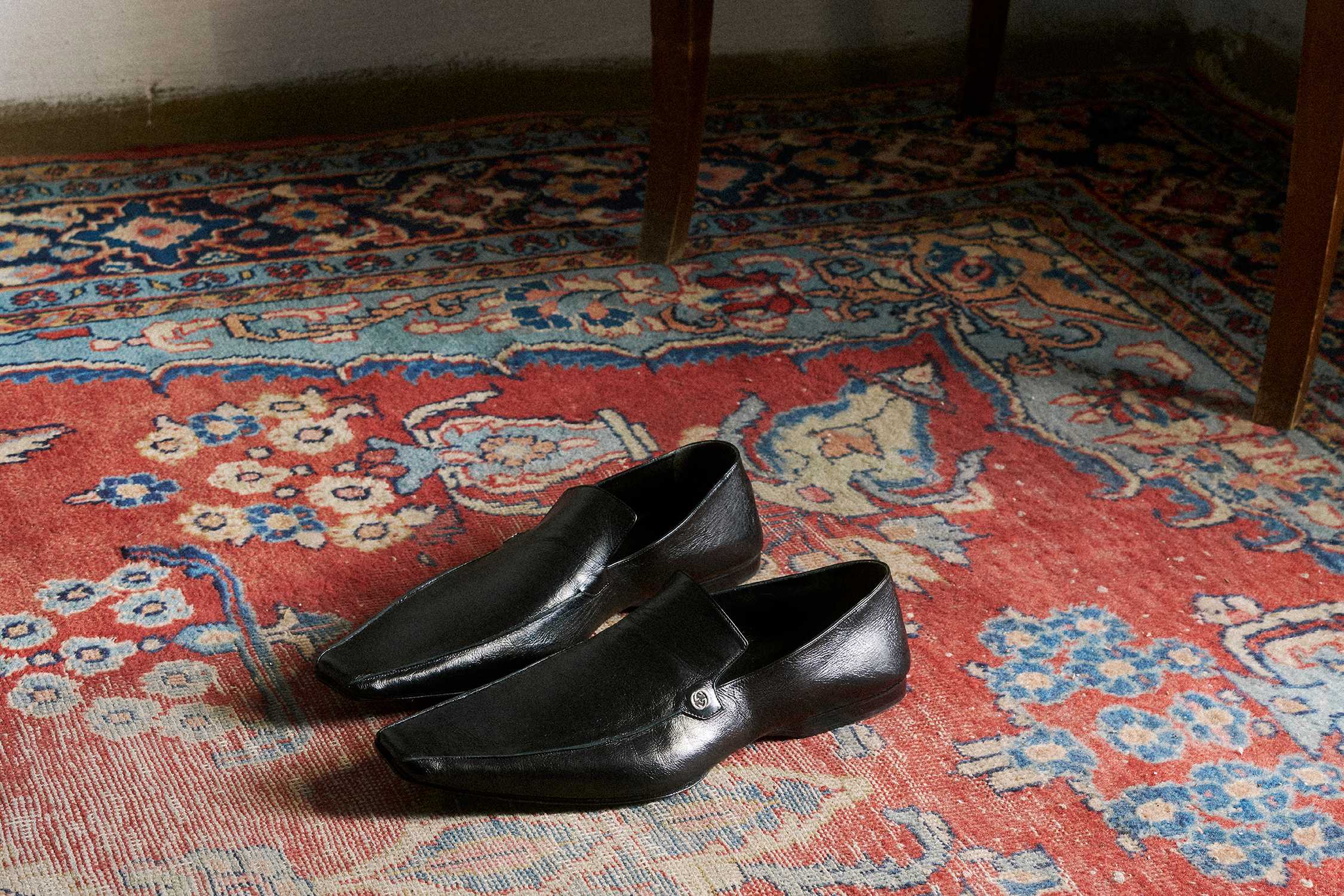 Black Gucci leather loafers pair
