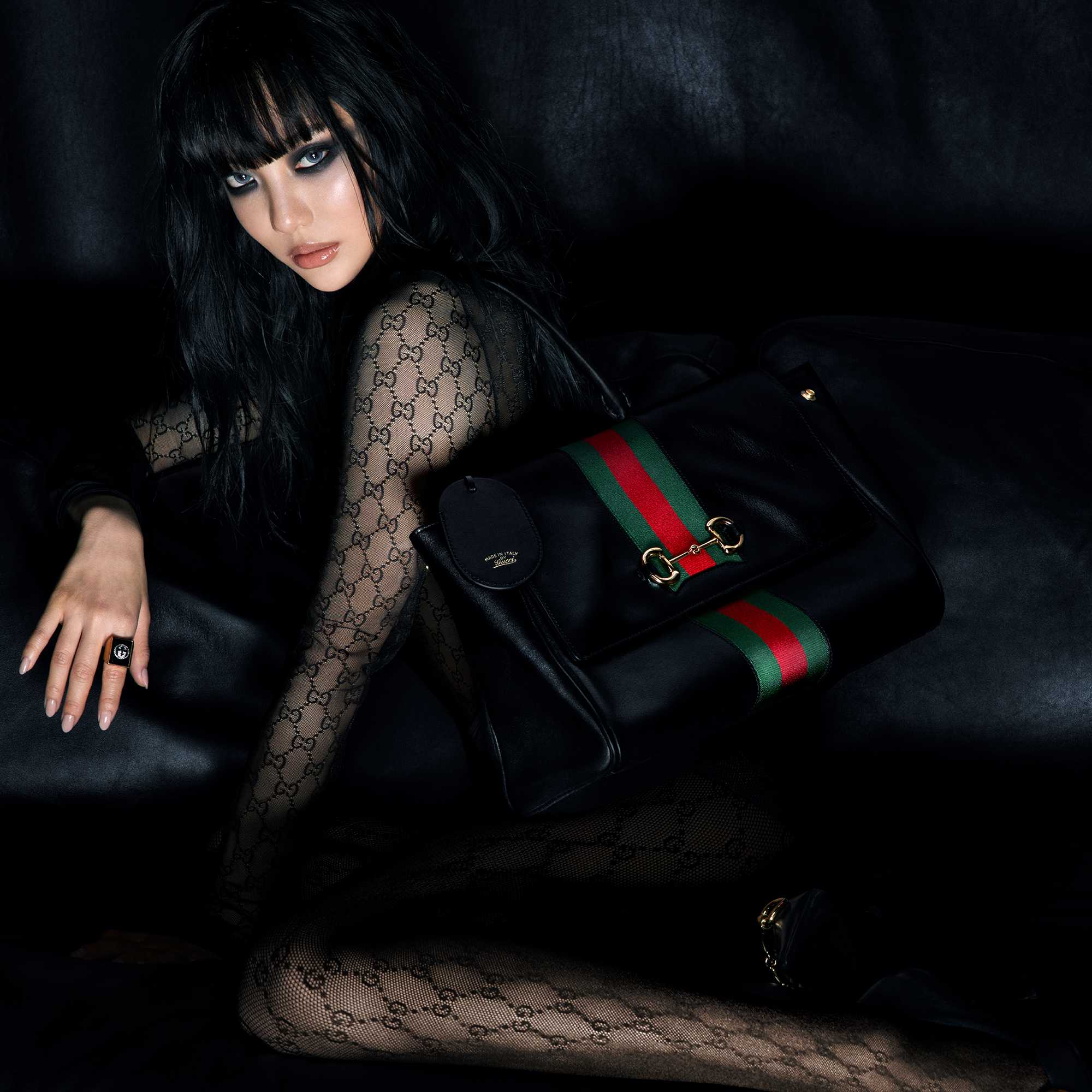 Black Gucci quilted handbag featured.