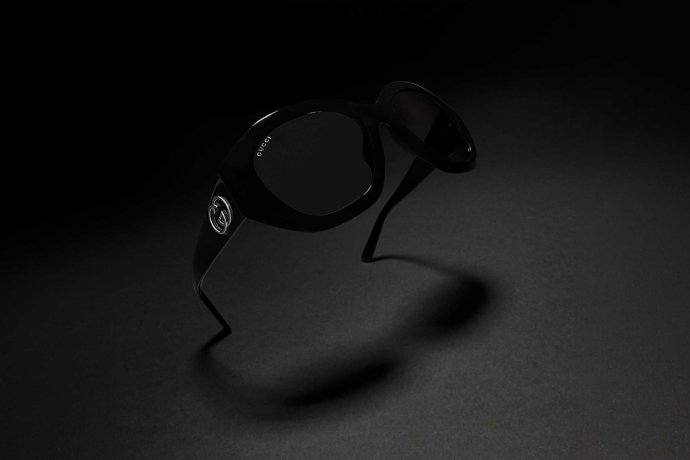 Black Gucci oversized sunglasses floating