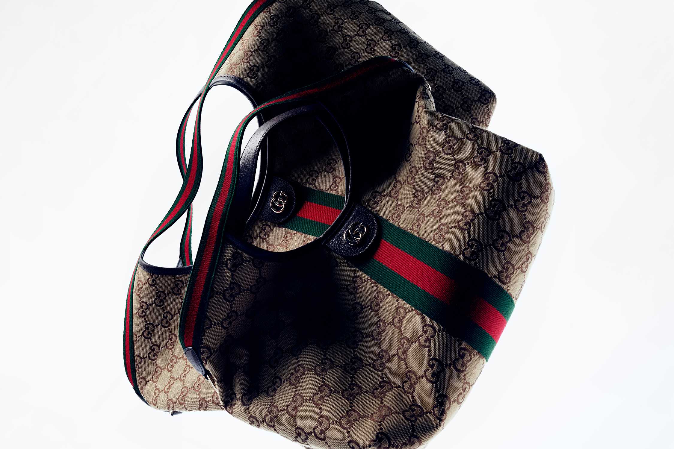 Brown Gucci bag with red-green stripes.