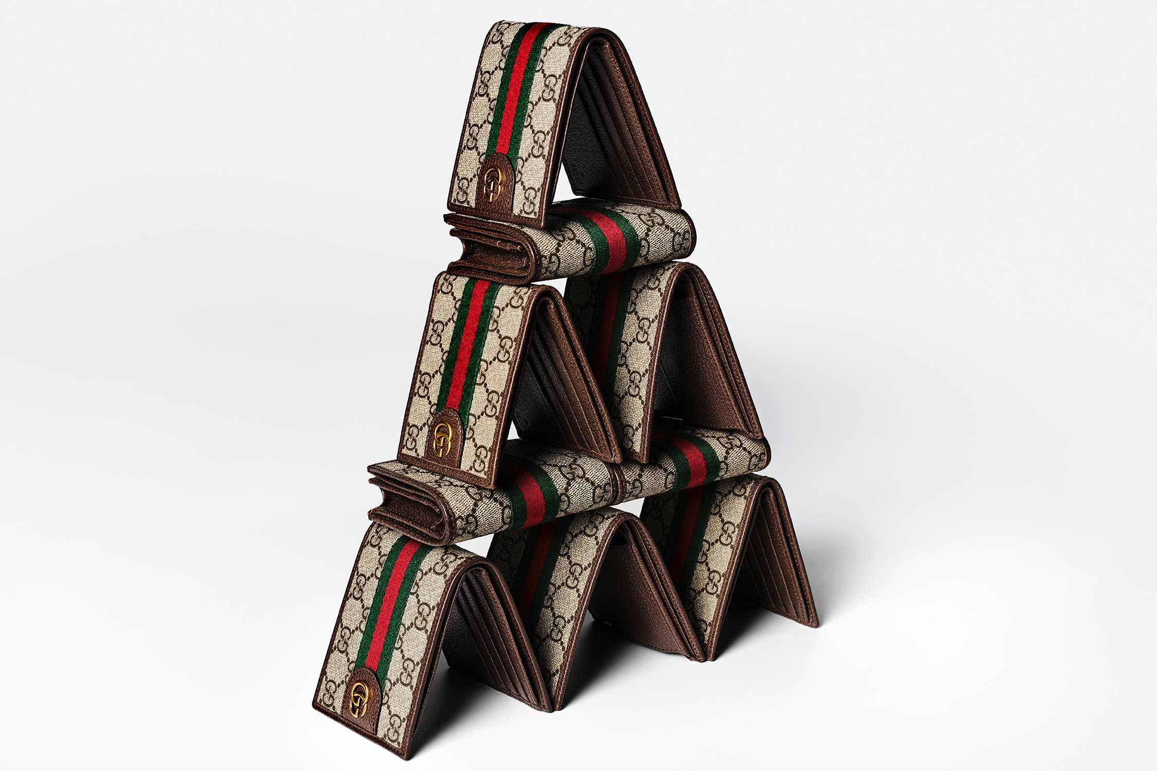 Stacked Gucci monogram wallets, red-green-stripe.