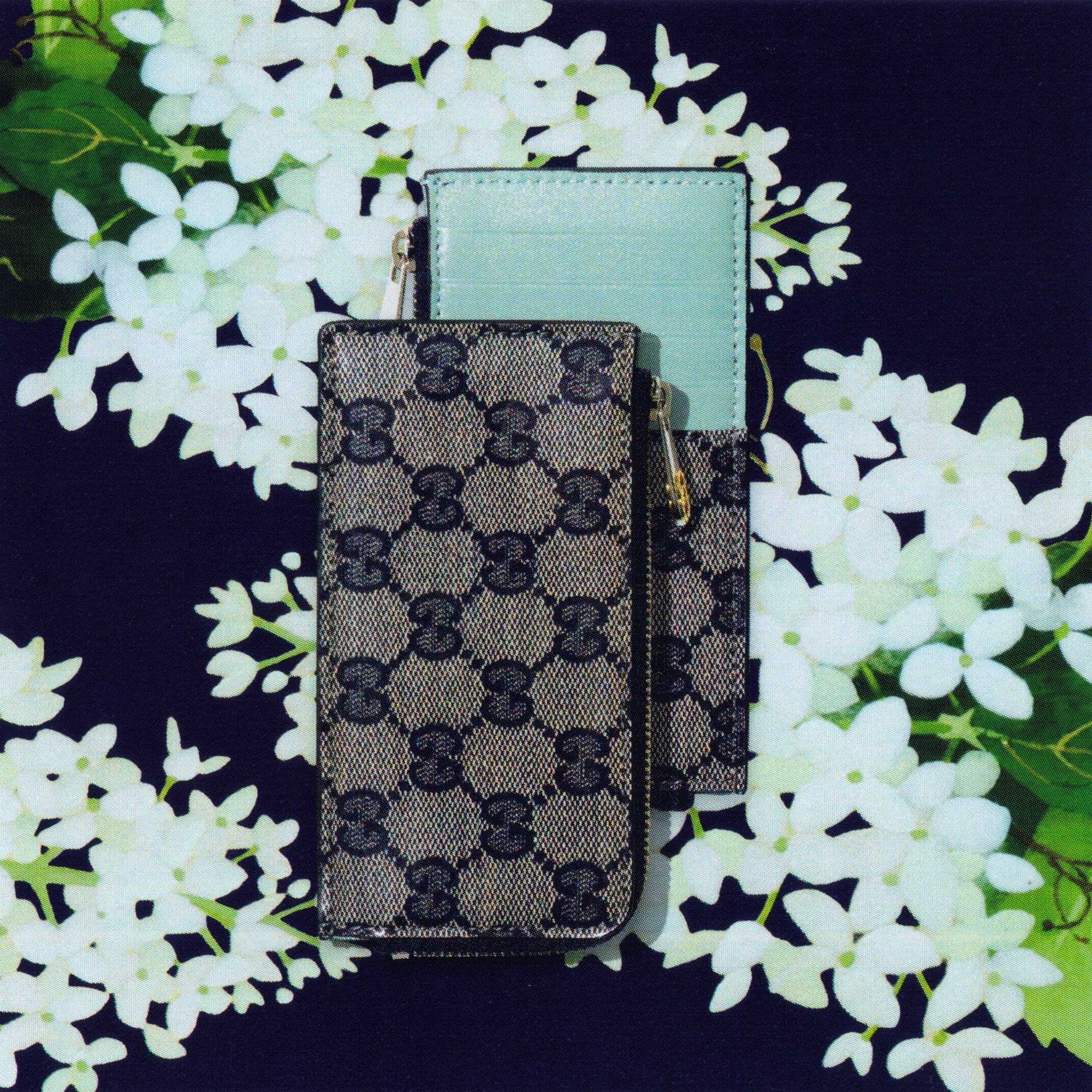 Gucci wallets and black sunglasses