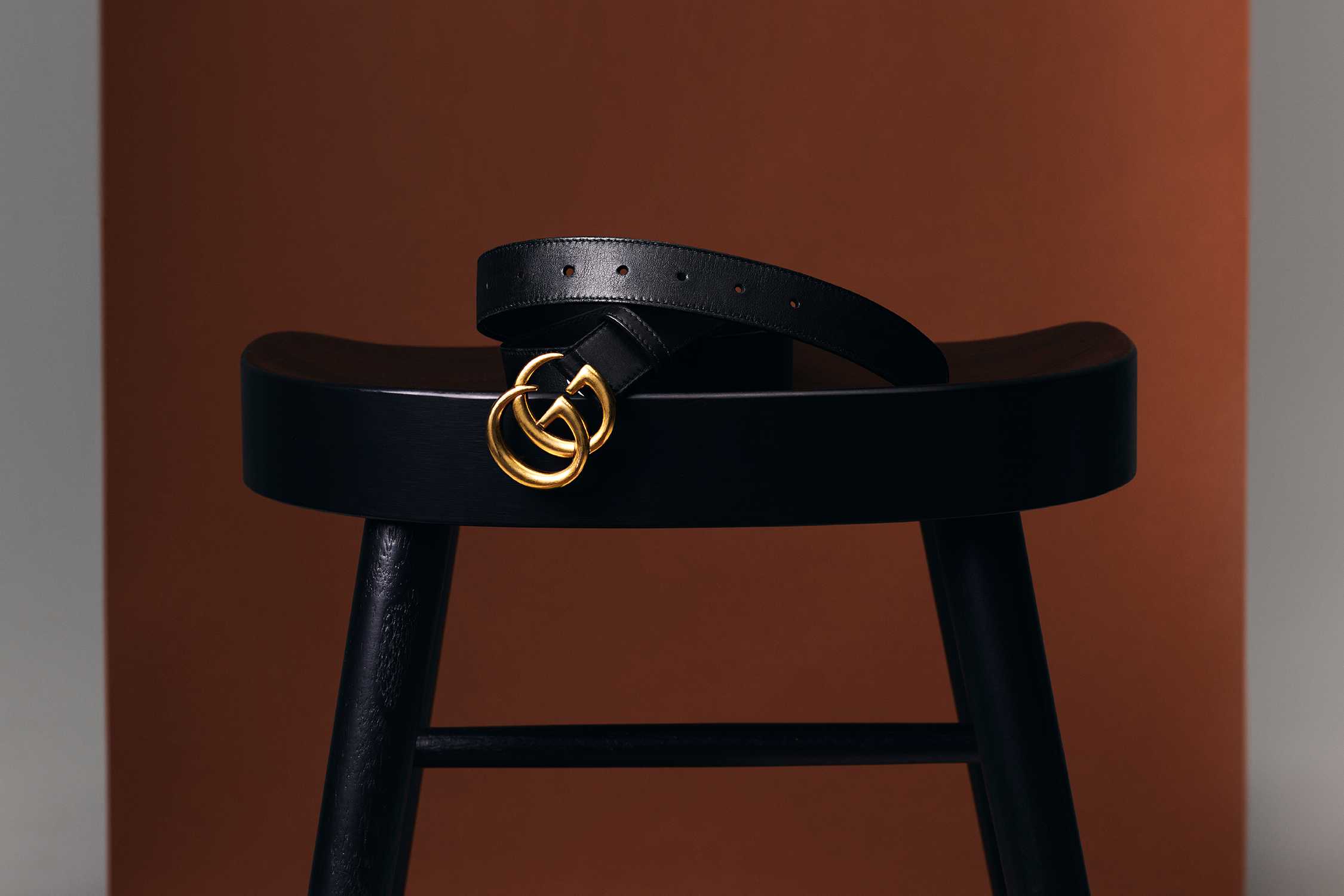 Black Gucci belt gold buckle