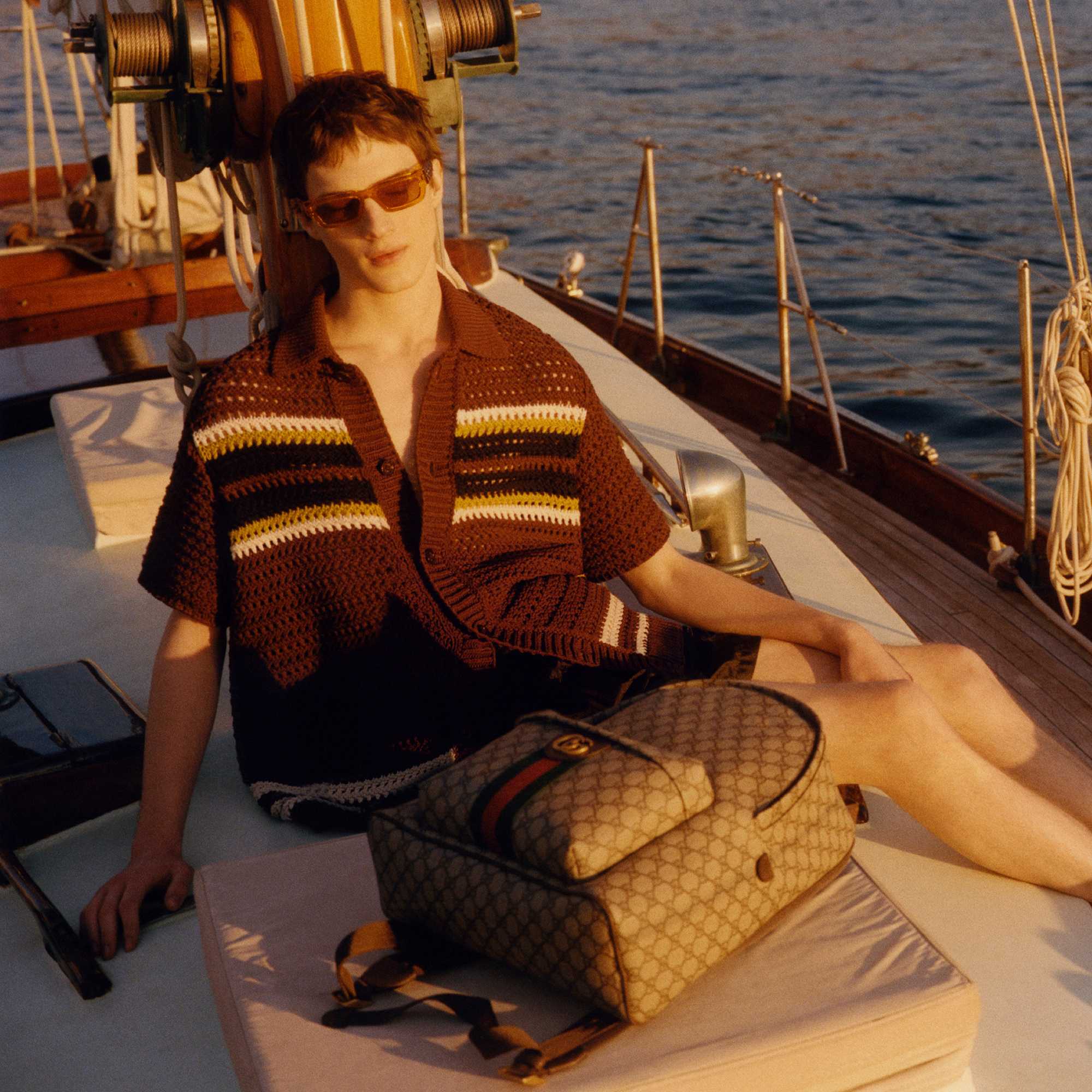 Beige Gucci backpack on yacht