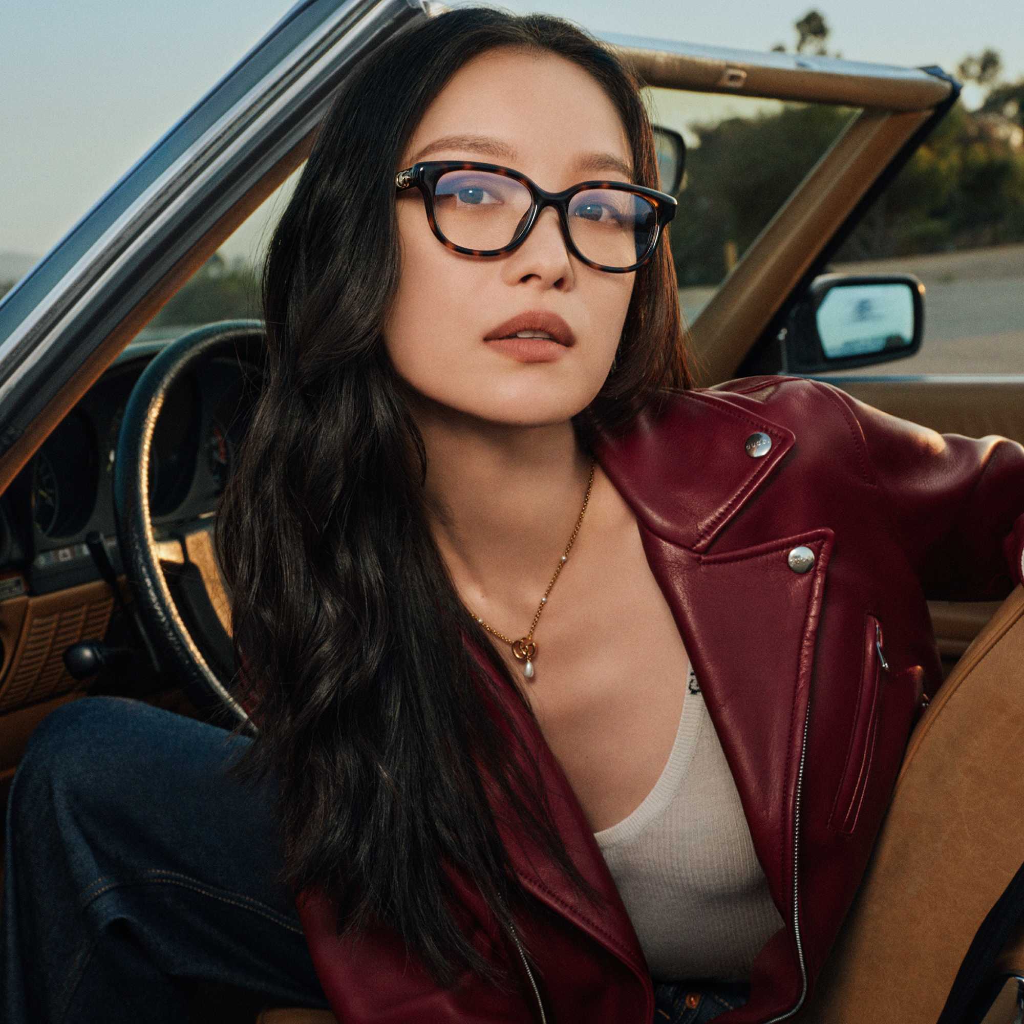 Gucci black glasses burgundy jacket