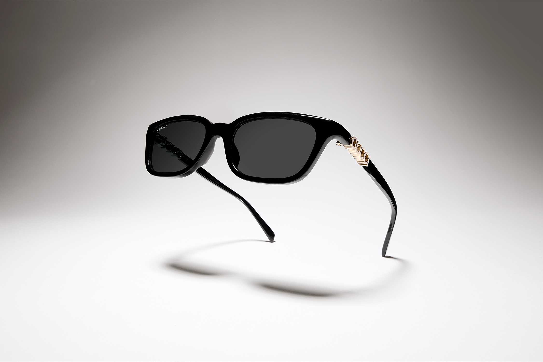 Black Gucci sunglasses gold detail