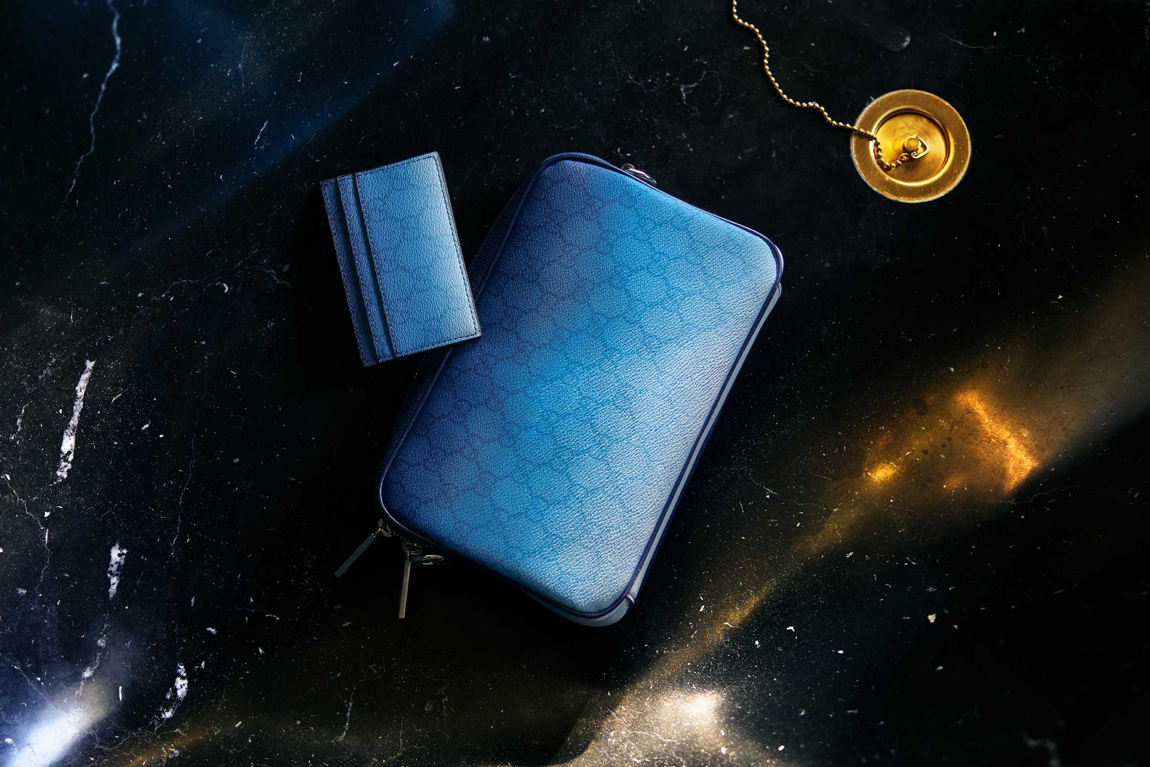Blue leather accessories on marble