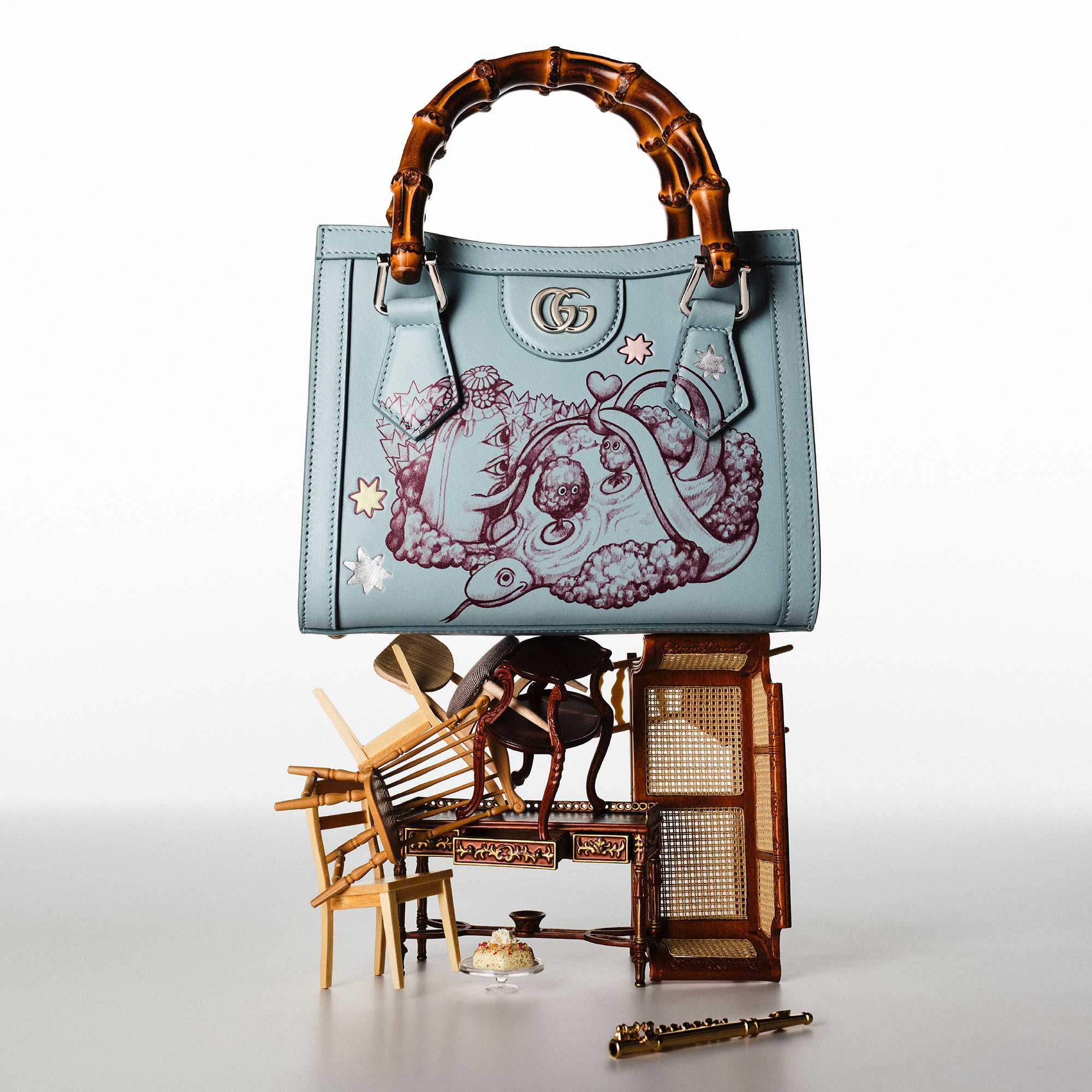 Black Gucci quilted handbag featured.